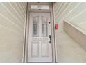 Elegant condo front door with decorative glass panels and secure entry system at 19010 Gulf Blvd # 203, Indian Shores, FL 33785