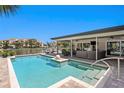 Inviting pool with covered patio, canal view, and comfortable outdoor seating at 2817 Seabreeze S Dr, Gulfport, FL 33707