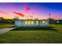Exterior of a well-maintained single-story home with a fenced yard at 3614 Vasco St, Punta Gorda, FL 33950