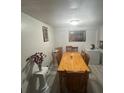 Cozy dining room featuring a wooden dining table and floors at 4150 Woodsville Dr, New Port Richey, FL 34652