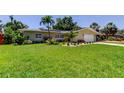 Charming single-Gathering home featuring well-kept landscaping and a sprawling green lawn at 4174 14Th Ne Ln, St Petersburg, FL 33703