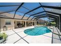 Backyard features a screened-in pool, offering a private oasis for relaxation and outdoor entertainment at 5465 Chestnut Ridge Rd, Dade City, FL 33523
