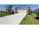 Well-maintained single-Gathering home with a concrete driveway and attached two-car garage at 5920 Silver Palm Blvd, Bradenton, FL 34211