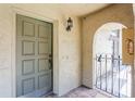 Townhome entryway featuring a decorative door, tiled floor, arched entrance, and classic light fixture at 6262 142Nd N Ave # 607, Clearwater, FL 33760