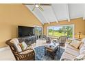 Comfortable living room with tile floors, golf course view and ceiling fan at 8103 Bardmoor Pl # 203G, Seminole, FL 33777