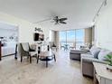 Bright living room with view of the water, comfortable seating, and stylish décor provides a relaxing atmosphere at 100 Pierce St # 910, Clearwater, FL 33756