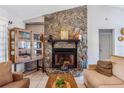 Close-up of the living room's stone fireplace, adding a touch of rustic charm to the home at 1024 Dockside Dr, Lutz, FL 33559