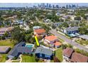 Aerial view showcasing the home's location, pool, landscaping, and proximity to Tampa Bay skyline at 111 Chesapeake Ave, Tampa, FL 33606
