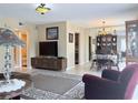 Open concept living room flowing into the dining area, filled with natural light at 11764 Raintree Dr # 0, Temple Terrace, FL 33617