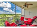Relaxing balcony area with comfortable seating and scenic views of the golf course and lake at 1200 Country Club Dr # 6302, Largo, FL 33771