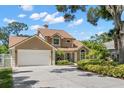 Lovely home with a two-car garage, beautiful landscaping, and a well-maintained front yard at 13598 Park Blvd, Seminole, FL 33776