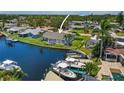 Waterfront home with backyard deck, dock, and lift, perfect for boating and enjoying the scenic canal views at 1382 52Nd Ne Ave, St Petersburg, FL 33703
