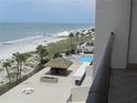 Captivating beach view with tropical cabanas and refreshing pool at 14950 Gulf Blvd # 603, Madeira Beach, FL 33708