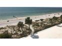 Expansive beach view featuring palm trees and the ocean at 14950 Gulf Blvd # 603, Madeira Beach, FL 33708