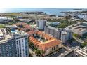 An aerial view of residential neighborhood near the ocean, with lush green spaces and city views at 200 4Th S Ave # 229, St Petersburg, FL 33701