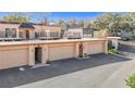 Aerial view of unit garages and driveways, surrounded by mature landscaping at 4405 Vieux Carre Cir # 4405, Tampa, FL 33613