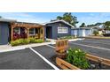 Charming single-story home featuring a modern exterior, well-manicured landscaping, and ample parking space at 601 Patricia Ave, Dunedin, FL 34698