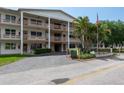 A spacious building with multiple stories, adorned with elegant columns and a well-maintained lawn at 6015 19Th N St # 311, St Petersburg, FL 33714