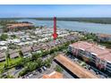 Aerial view of neighborhood, showcasing proximity to lake and nearby amenities at 10560 Lake Seminole Ter, Seminole, FL 33772
