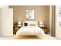 Inviting bedroom featuring a soft yellow color scheme, decorative artwork, and natural lighting at 11118 E 65Th Ter, Palmetto, FL 34221