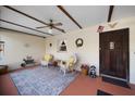 Cozy front porch with comfortable seating, decorative rug, and charming decorations at 1799 Dixie Hwy, Tarpon Springs, FL 34689