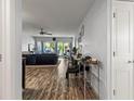 View of the home's bright and airy living room and sliding glass doors to the balcony at 19029 Us Highway 19 N # 5-16, Clearwater, FL 33764