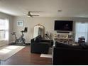 Comfortable living room featuring a stationary bike, modern furniture, and hardwood floors at 2745 4Th S Ave, St Petersburg, FL 33712