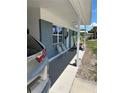 Charming front porch with decorative chairs and blue brick exterior at 5608 Larimer Dr, Tampa, FL 33615