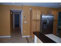 An open kitchen flows into an adjacent hallway, highlighted by stainless steel appliances and ample storage at 6326 55Th N Ave, St Petersburg, FL 33709
