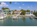 Waterfront home featuring a private dock and stunning ocean views at 811 Bay Point Dr, Madeira Beach, FL 33708