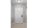Entryway with a white front door that leads into the home at 9519 Newdale Way # 202, Riverview, FL 33578