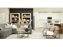 Modern living room with gray sofa, stylish decor and an open-concept to white kitchen at 10873 Rustic Eve Ct, Land O Lakes, FL 34638