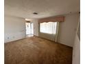 Bright living room features a window and entrance at 11198 58Th Ave, Seminole, FL 33772
