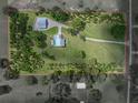 Aerial view outlining the spacious acreage, main house with pool, and separate workshop building at 16326 Kalli Way, Dade City, FL 33523