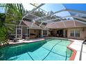 Refreshing screened-in pool area with ample patio space, perfect for outdoor entertaining and relaxation at 17321 Oak Ledge Dr, Lutz, FL 33549