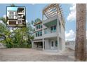 Rendering and exterior view of a new three-story house with an open garage and a pergola over the porch at 2301 N Ridgewood Ave, Tampa, FL 33602