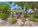 Charming home with a welcoming front porch and lush landscaping at 2450 2Nd N Ave, St Petersburg, FL 33713