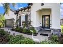 Inviting home with brick walkway, well-manicured landscaping, and stone accents at 2515 63Rd Ter E, Ellenton, FL 34222