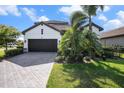 Beautiful home with a brick driveway, two-car garage and a well-manicured lawn at 2515 63Rd Ter E, Ellenton, FL 34222