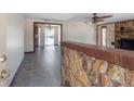 Inviting living area featuring tile floors, stone accents, and natural light at 2614 E Liberty St, Tampa, FL 33612