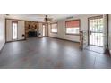Open living room showcasing tile flooring, fireplace, and ample space at 2614 E Liberty St, Tampa, FL 33612