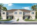 Inviting townhome features a well-manicured lawn, a private garage, and a welcoming dark front door at 31268 Paper Birch St, Wesley Chapel, FL 33545