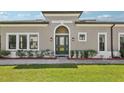 Home with a well-manicured lawn and garden, complemented by a neutral-colored exterior at 4325 Barletta Ct, Wesley Chapel, FL 33543