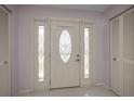 Bright foyer features tiled floor and closet space at 5480 Orange Blossom N Rd, Pinellas Park, FL 33782