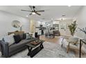 Cozy living room flowing into the kitchen area with new hardwood floors at 5624 62Nd N St, St Petersburg, FL 33709