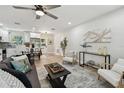 Bright living room featuring a ceiling fan, hardwood floors, and ample seating at 5624 62Nd N St, St Petersburg, FL 33709
