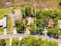 Aerial view highlighting property lines and the home's location near a road, showcasing the area at 577 Waterfall Dr, Spring Hill, FL 34608
