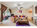 Cozy living room with plush seating and sliding glass doors to outdoor patio at 601 52Nd Ter N, St Petersburg, FL 33703
