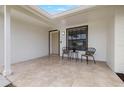 Inviting front porch with tile flooring and cozy seating area at 6433 Reef Cir, Tampa, FL 33625