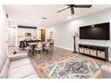 Open concept living room and kitchen features sleek floors and modern finishes at 14245 Damselfly Dr, Tampa, FL 33625